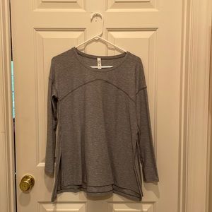 super cute and comfy lululemon shirt with little slits on the side in grey!